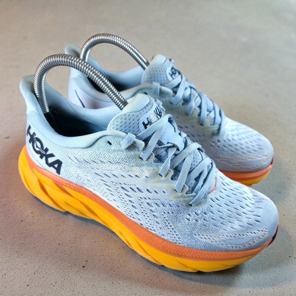 Hoka One One Women's Light Blue Running Shoes with Yellow and Orange Midsole